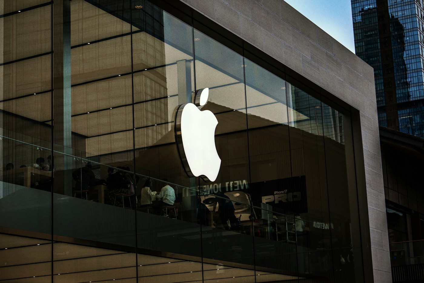 Apple store exterior with illuminated logo