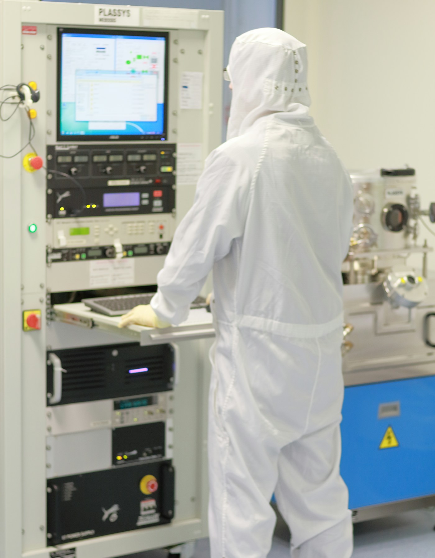 Engineer in a semiconductor cleanroom
