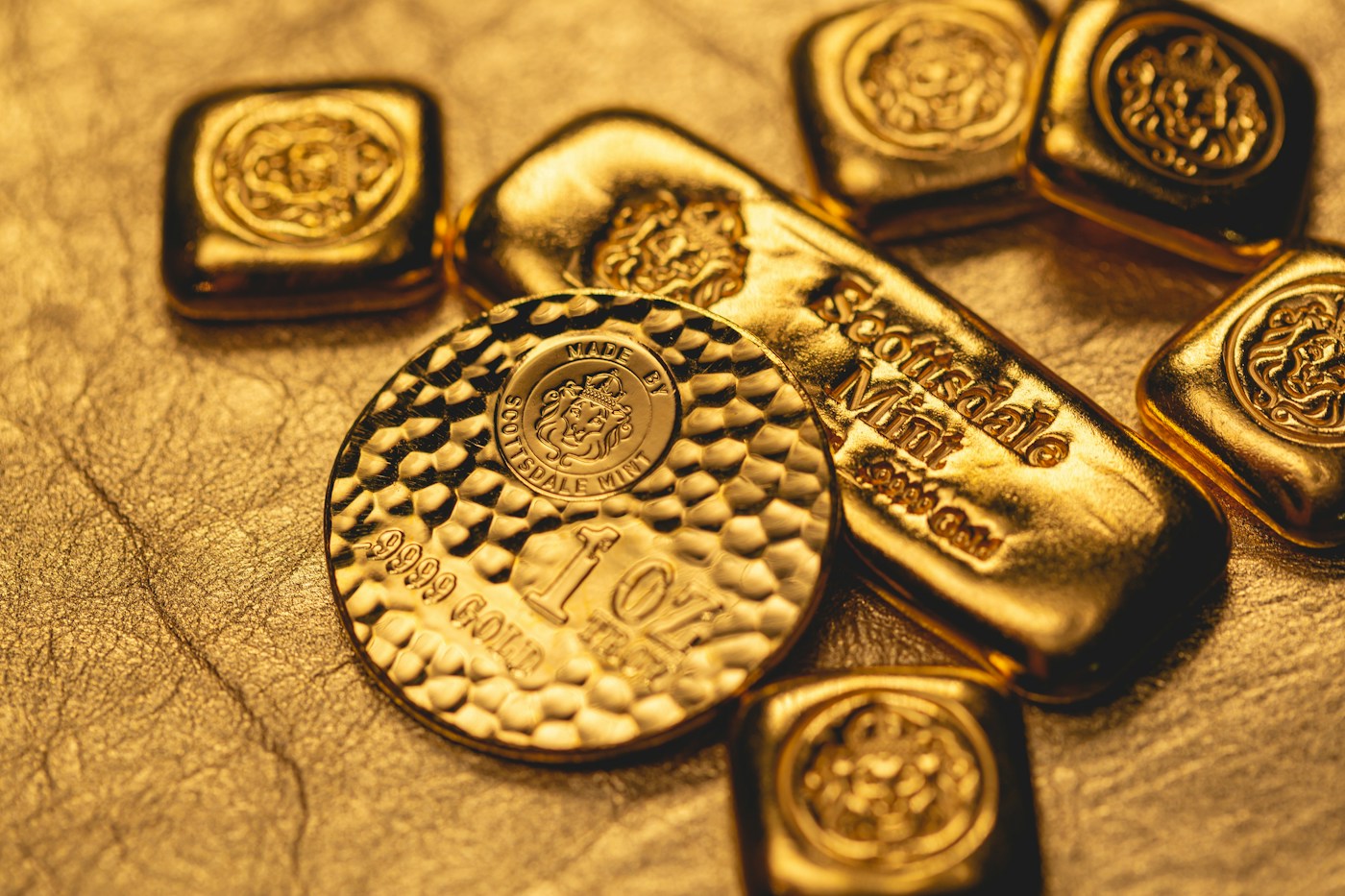 Gold bars and a gold coin